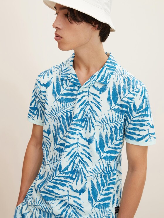 Polo shirt with a palm tree print