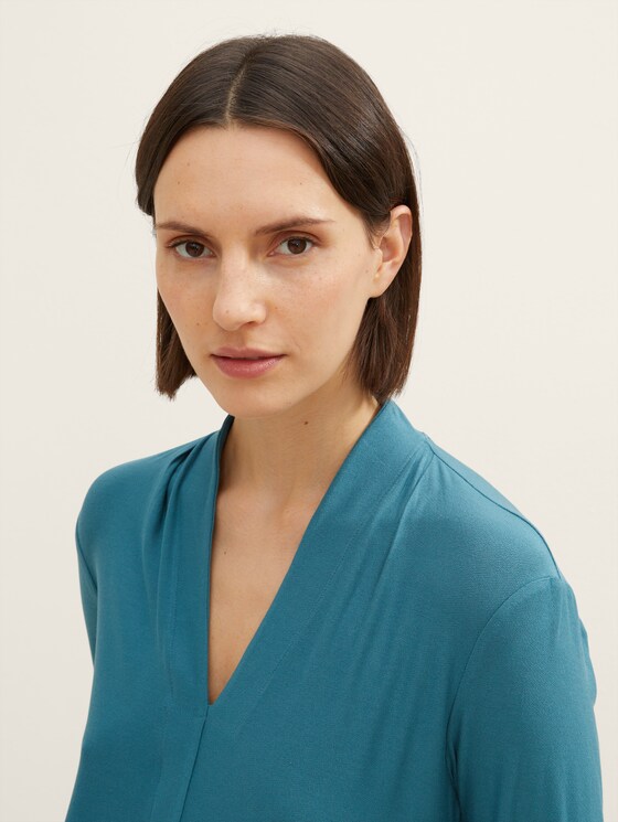 long-sleeved shirt with a V-neckline