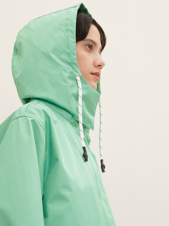 Raincoat with a removable hood