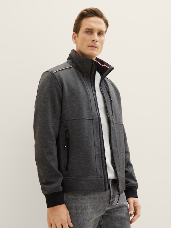 Jacket with a concealed hood