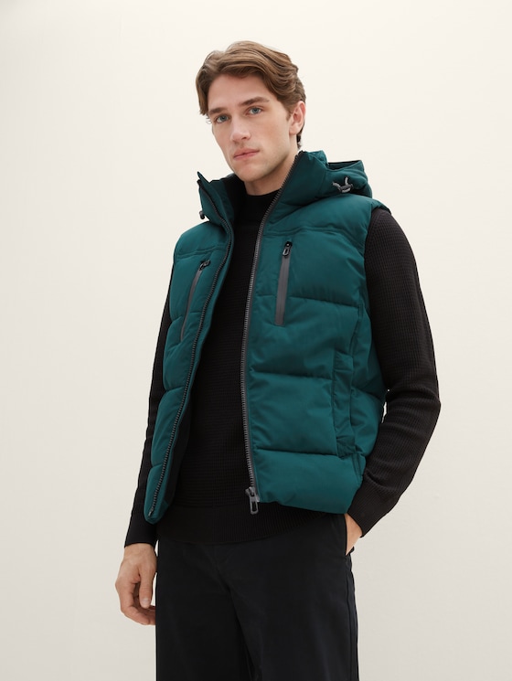 Puffer vest with a removable hood