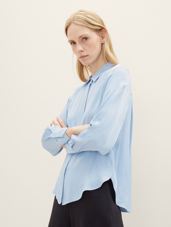 Blouse with a concealed button tab