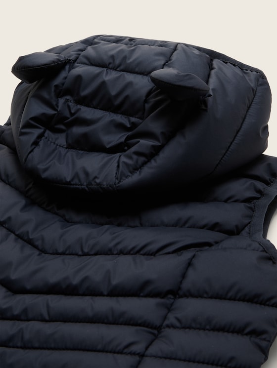 Quilted vest with a hood