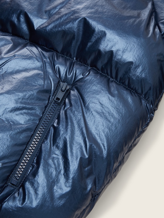 Puffer jacket with a concealed hood