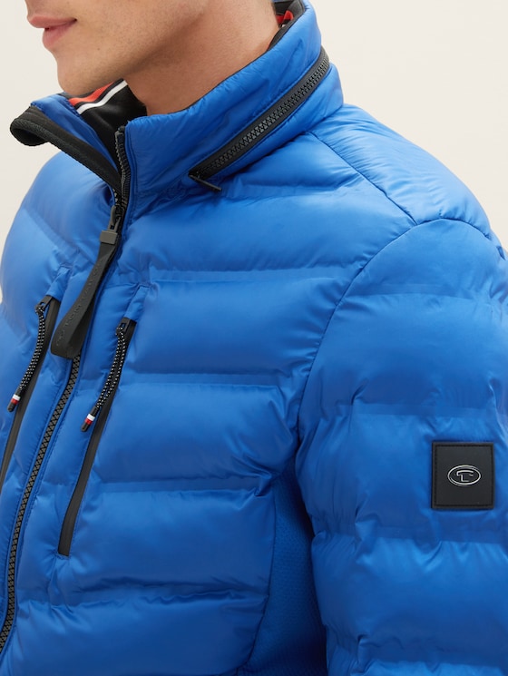 Hybrid jacket with a detachable hood