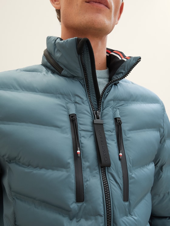 Hybrid jacket with a detachable hood