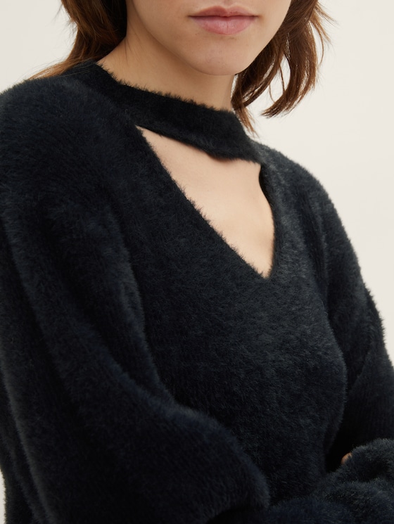 Knitted sweater with a cut-out