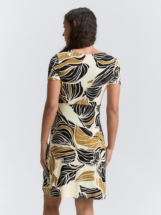 Dress with ruffles by Women, neutral cut leaves design