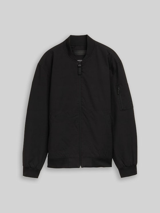 Bomber jacket made from water-repellent material in black by Tom