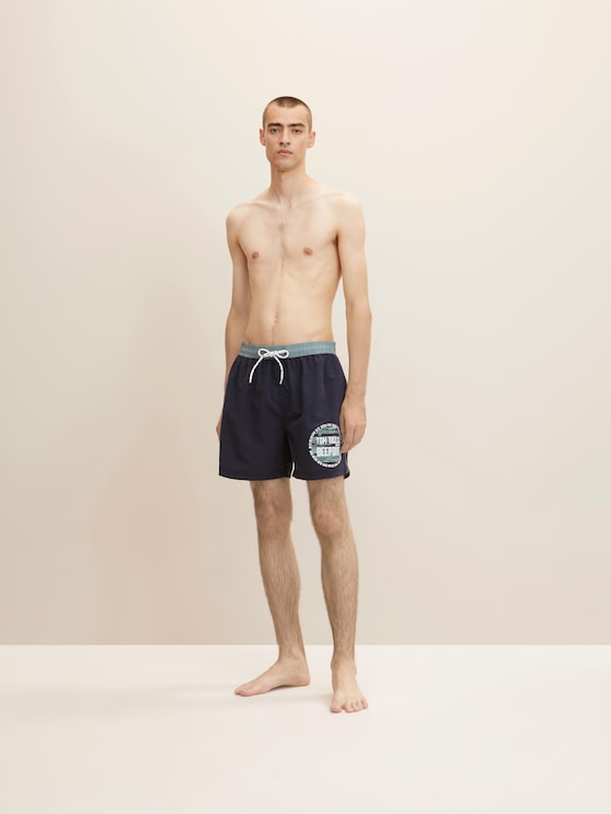 Swimming trunks with a side print