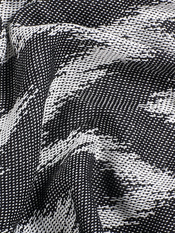 Geweven deken in getand patroon