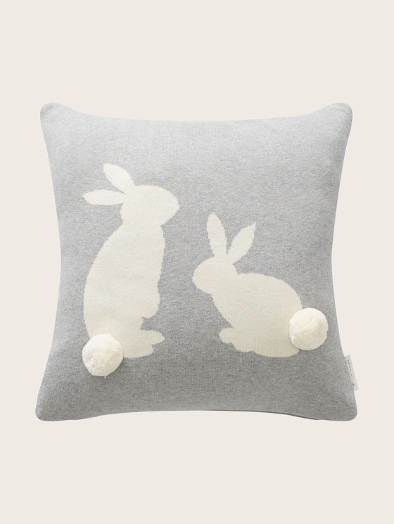 Knitted cushion cover with a rabbit motif