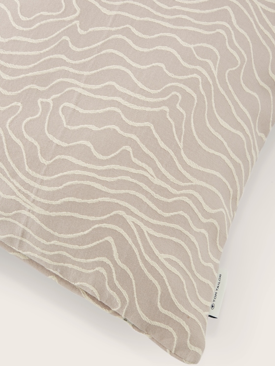 Woven decorative cushion cover with a wave pattern