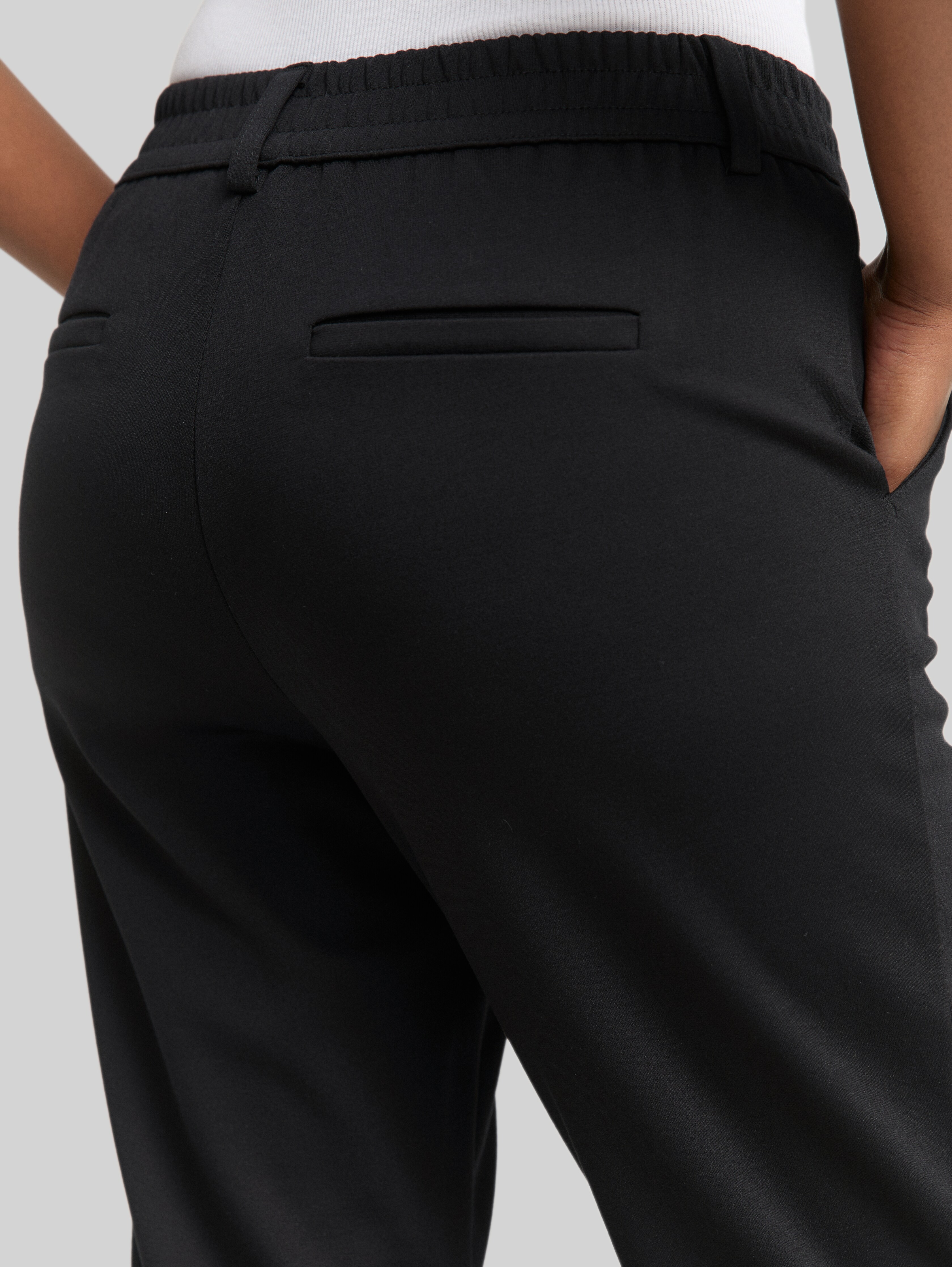 Relaxed-fit trousers with elasticated waistband in black by Tom Tailor