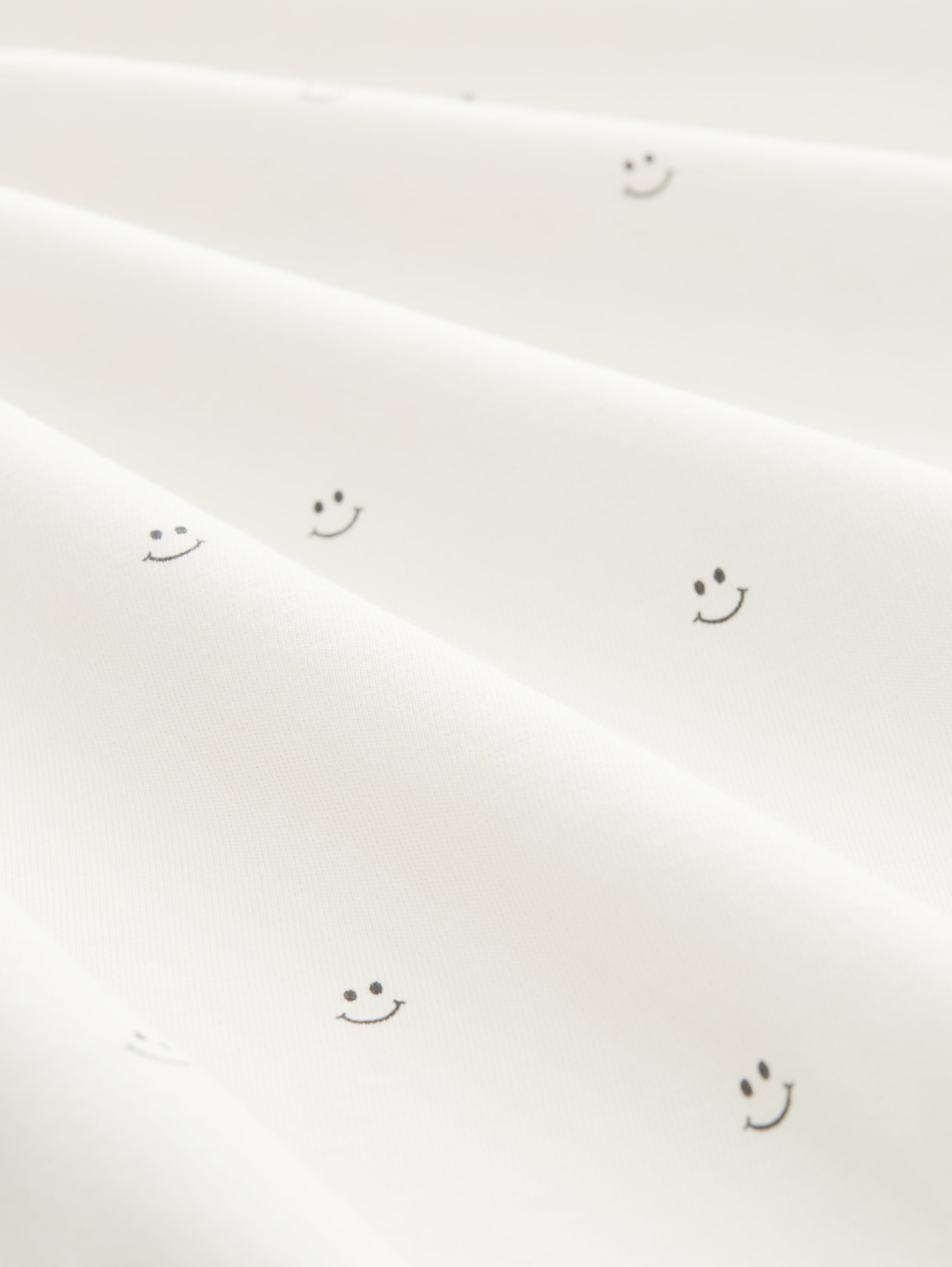 T-shirt with an all-over print - white smiley print - Material view