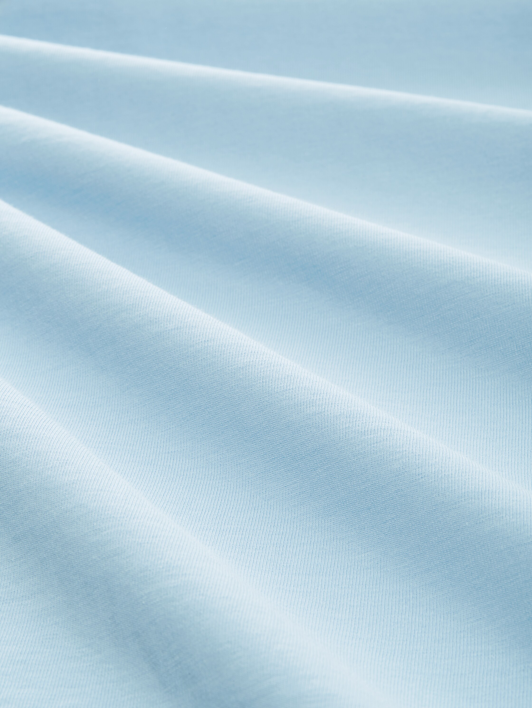 T-Shirt mit Logo Print - washed out middle blue - Material-Ansicht