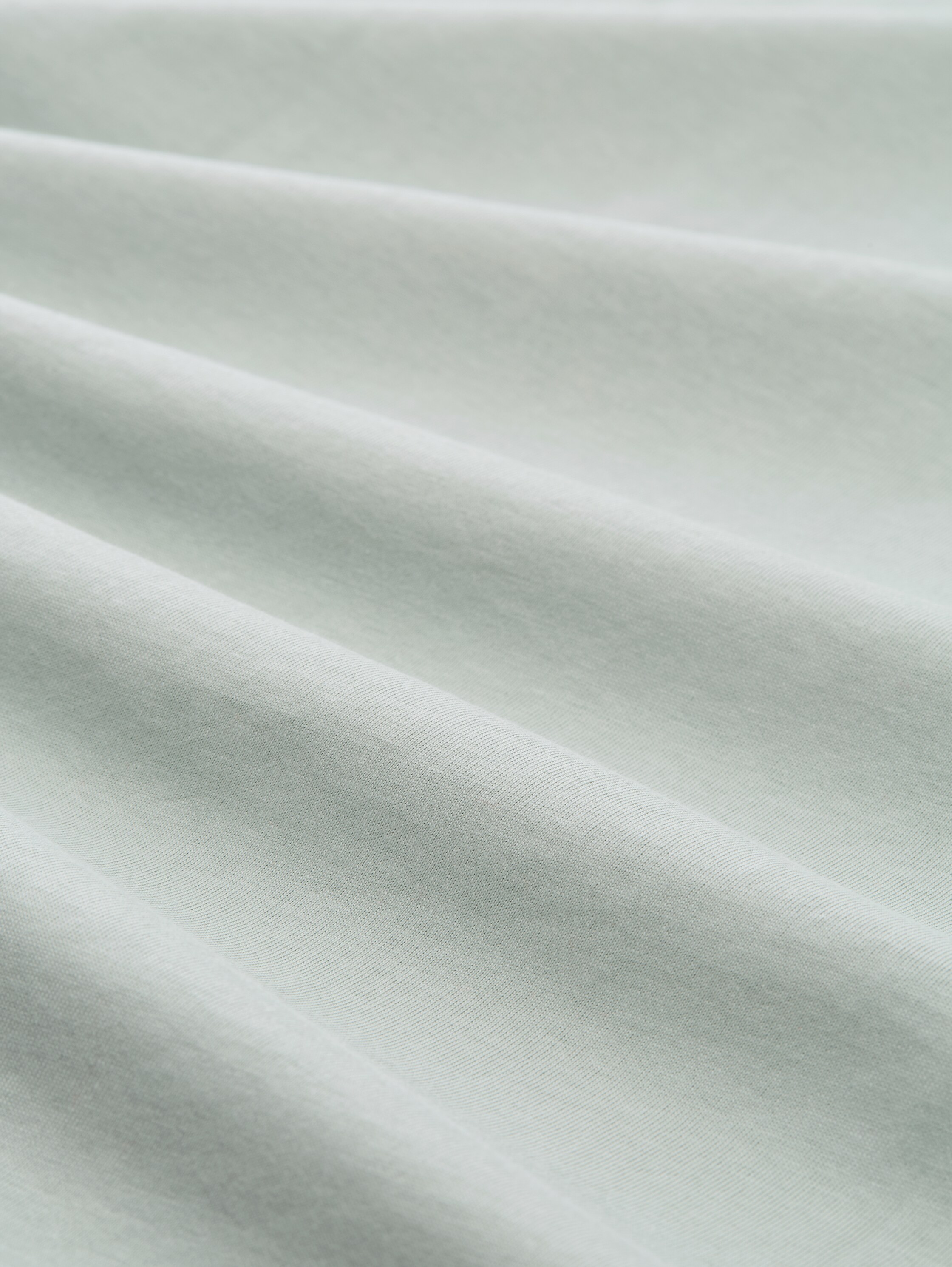 T-Shirt mit Logo-Print - soft greyish green - Material-Ansicht