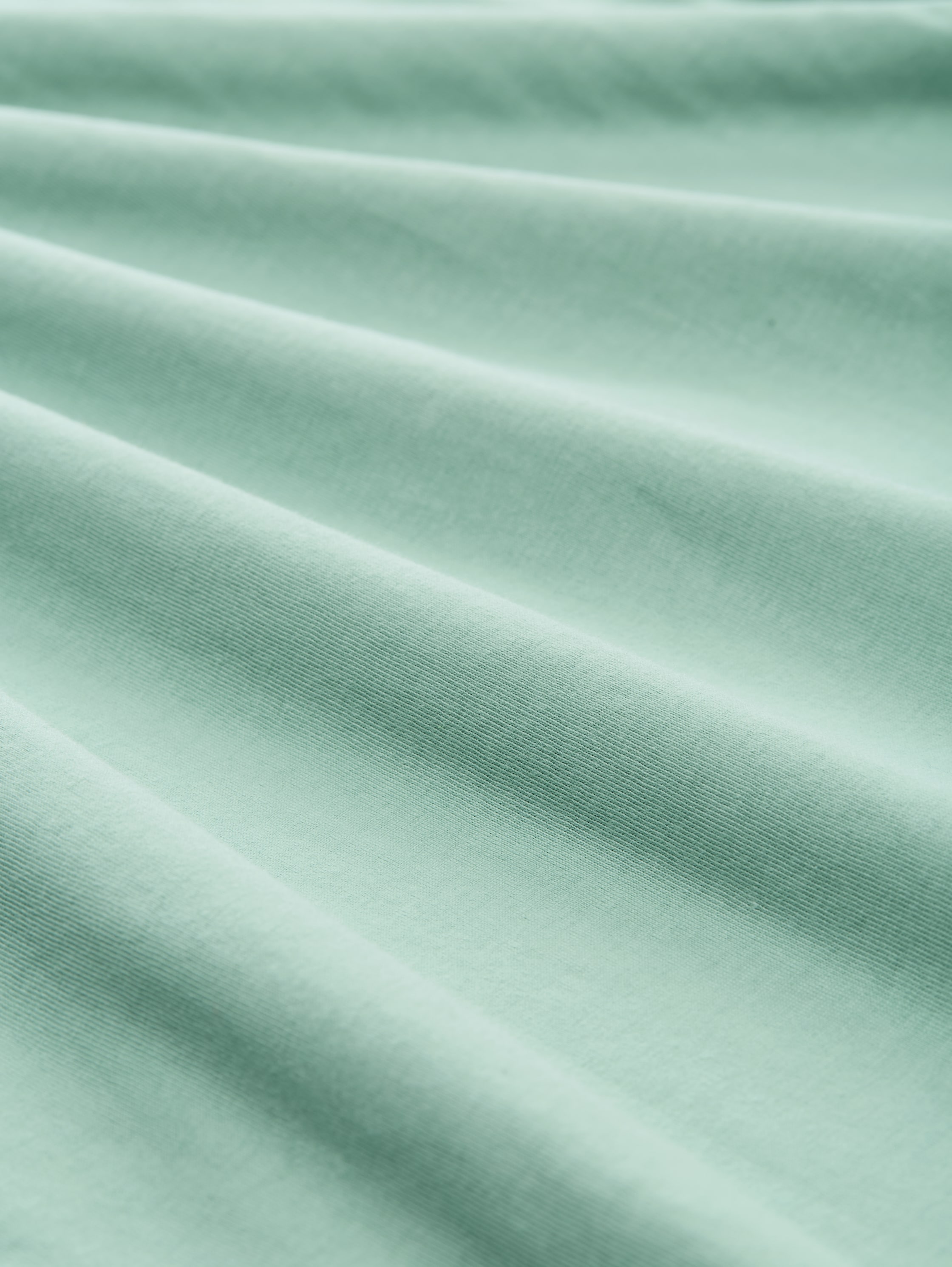 T-Shirt mit Logo-Print - dust green - Material-Ansicht