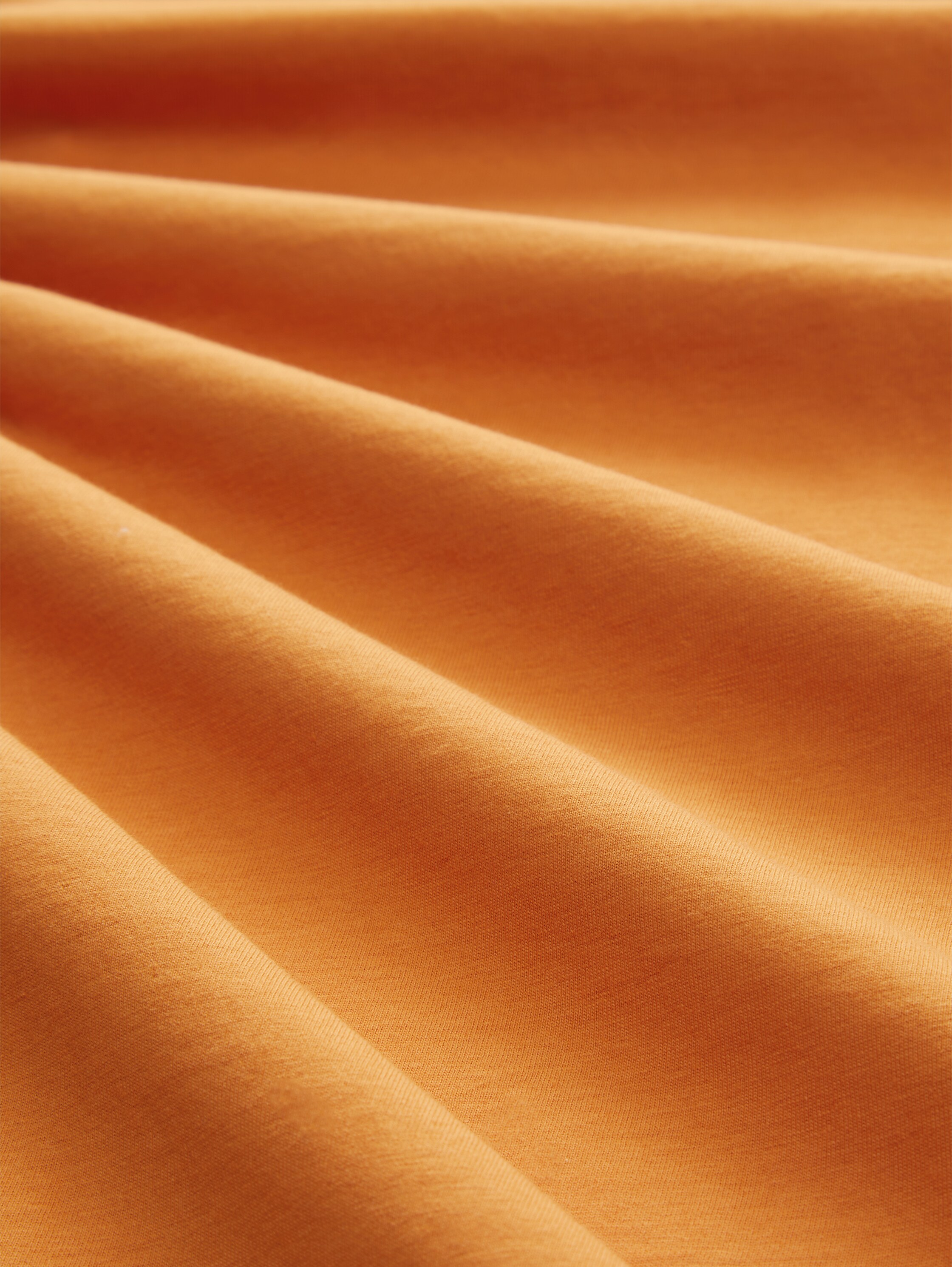 T-Shirt mit Print - tomato cream orange - Material-Ansicht