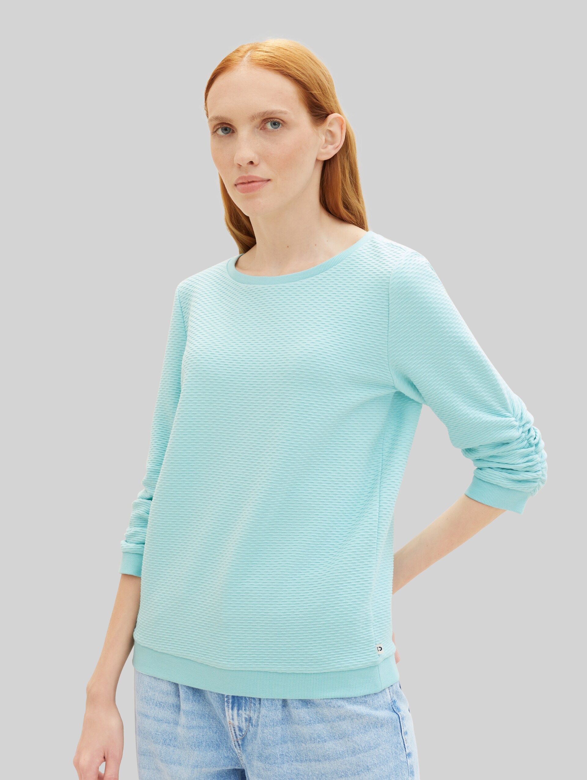 Sweatshirt with ruffles - pastel turquoise - Neckline model front view