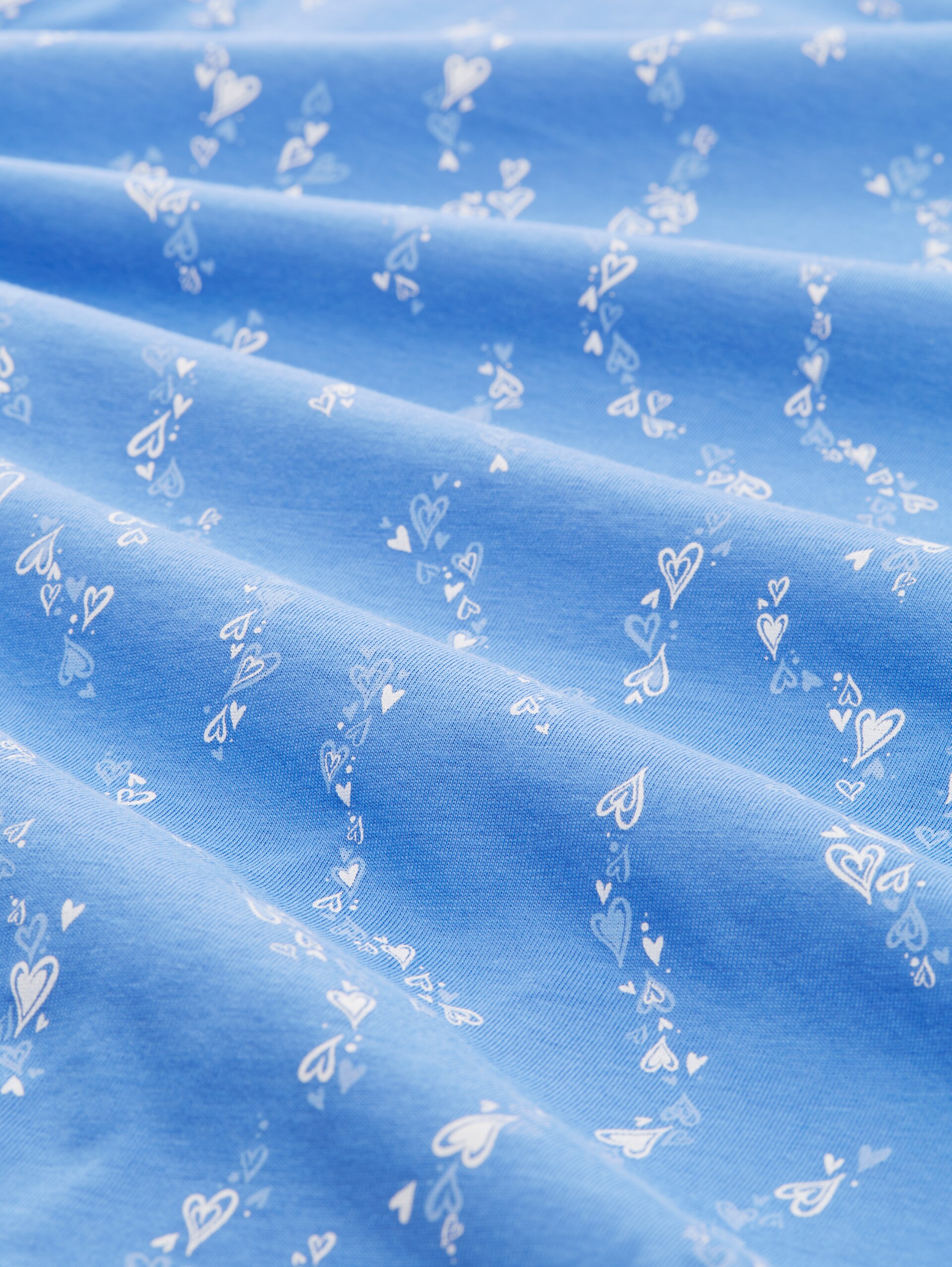 T-Shirt mit Knoten-Detail - mid blue white heart print - Material-Ansicht
