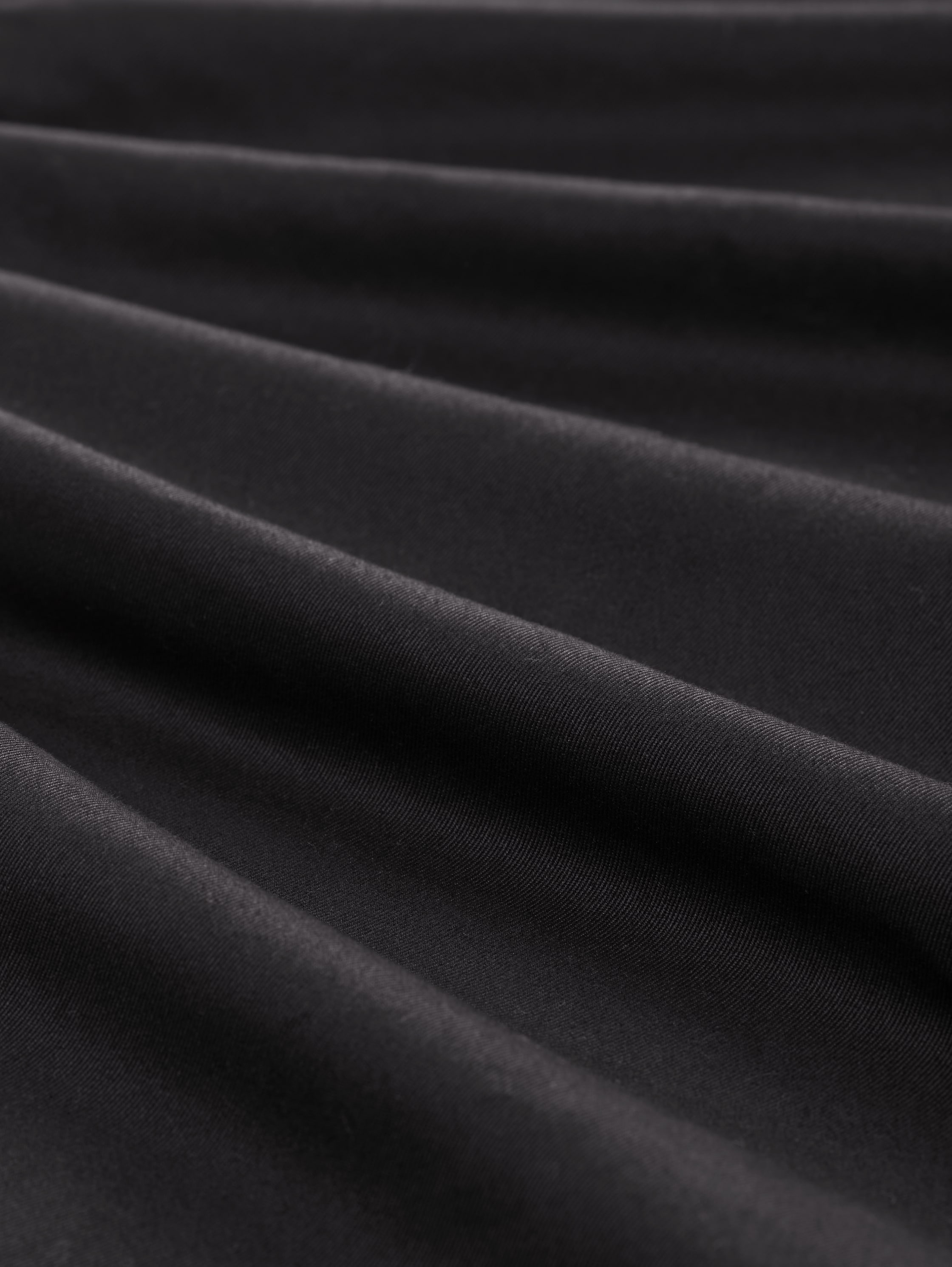 Loose-fit tapered trousers - black -