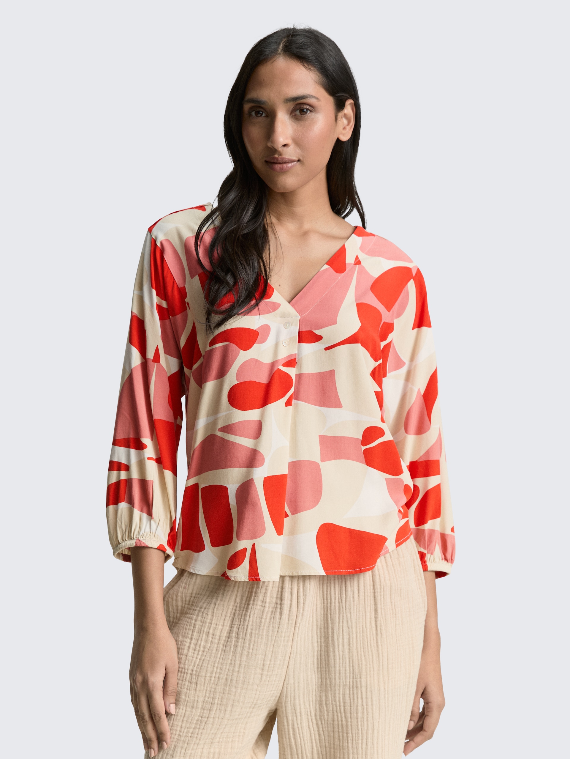 Patterned blouse - red dots and shapes design - Neckline model front view
