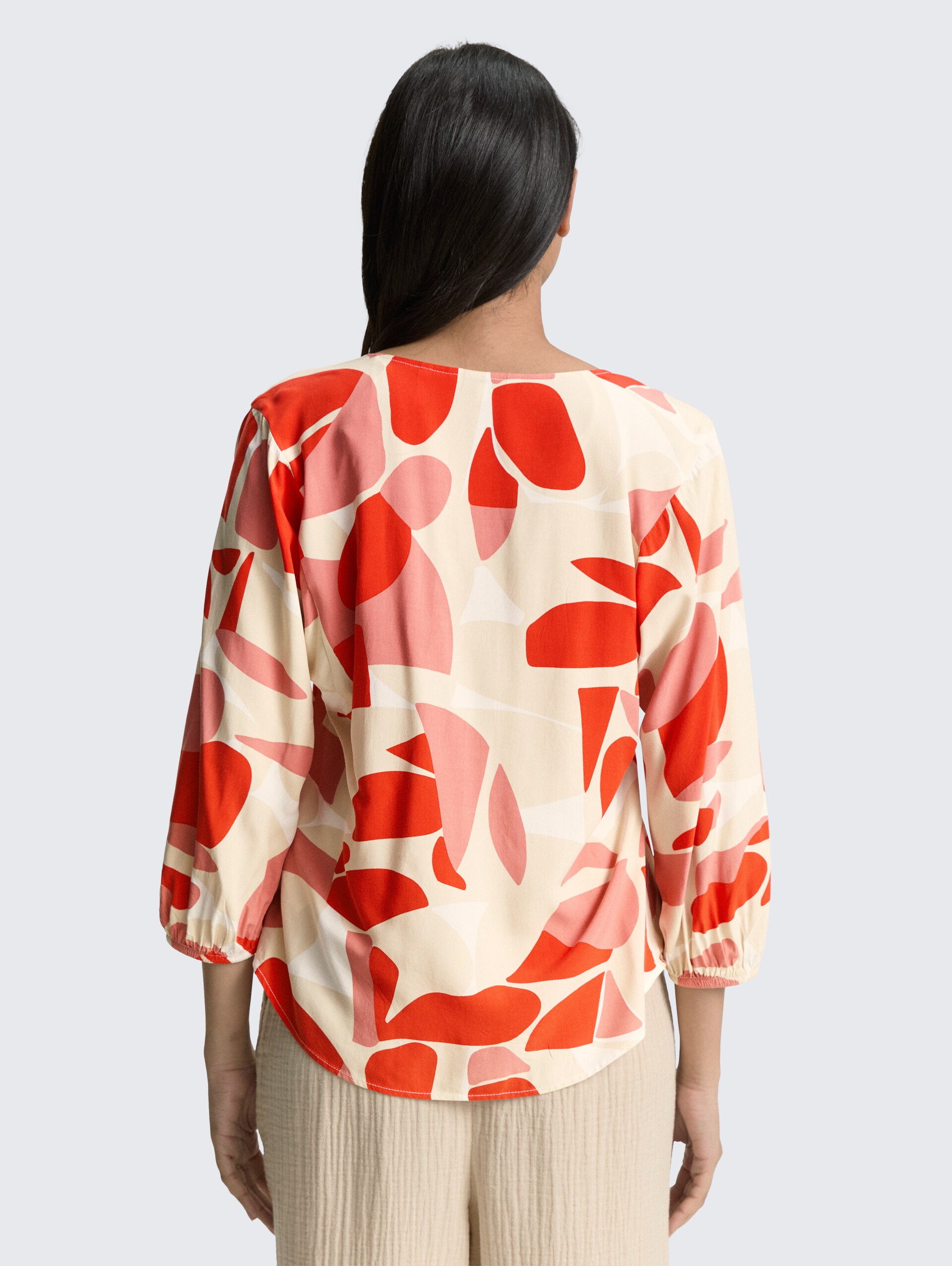 Patterned blouse - red dots and shapes design - Neckline model-back view