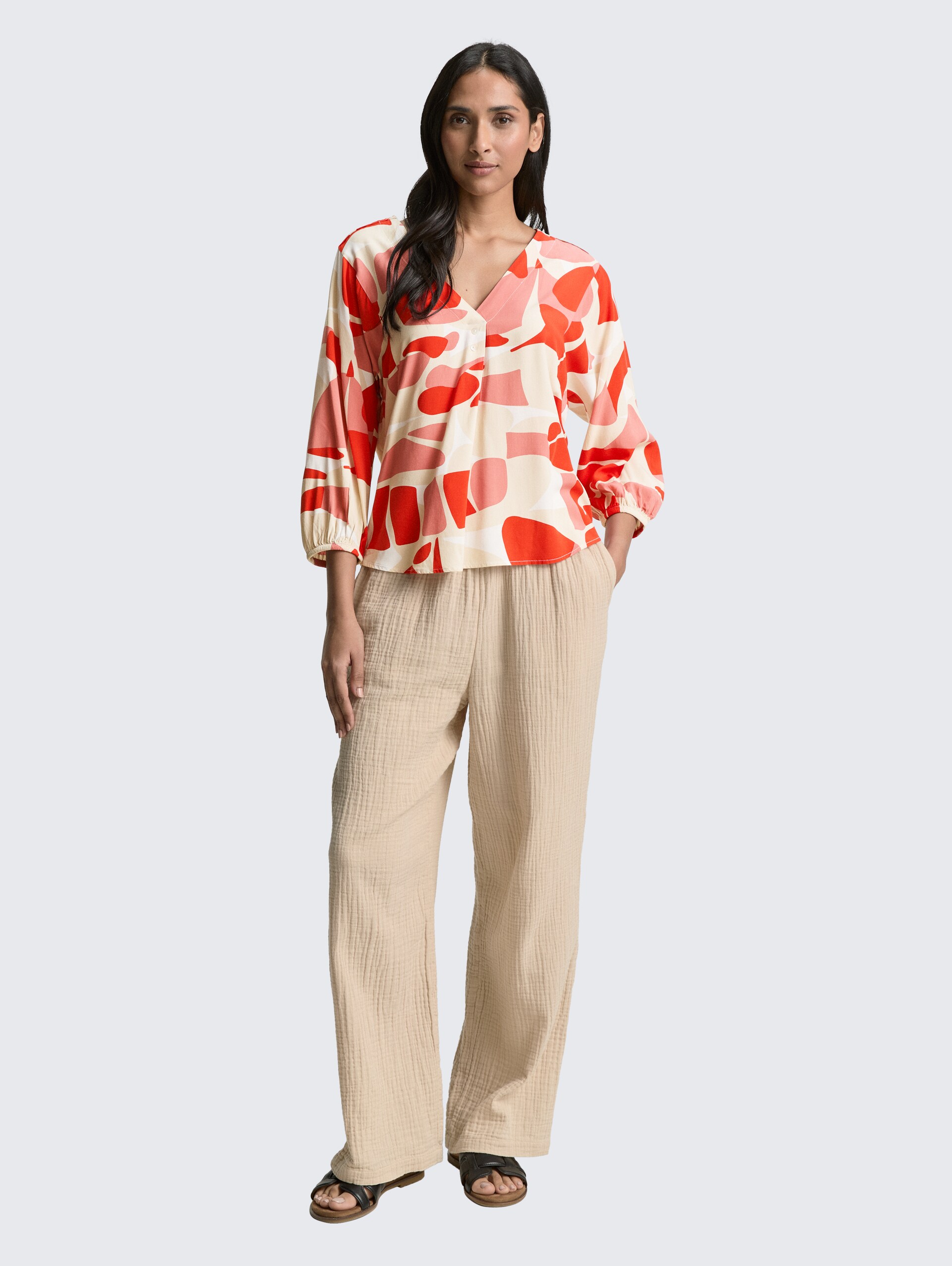 Patterned blouse - red dots and shapes design - Model front view