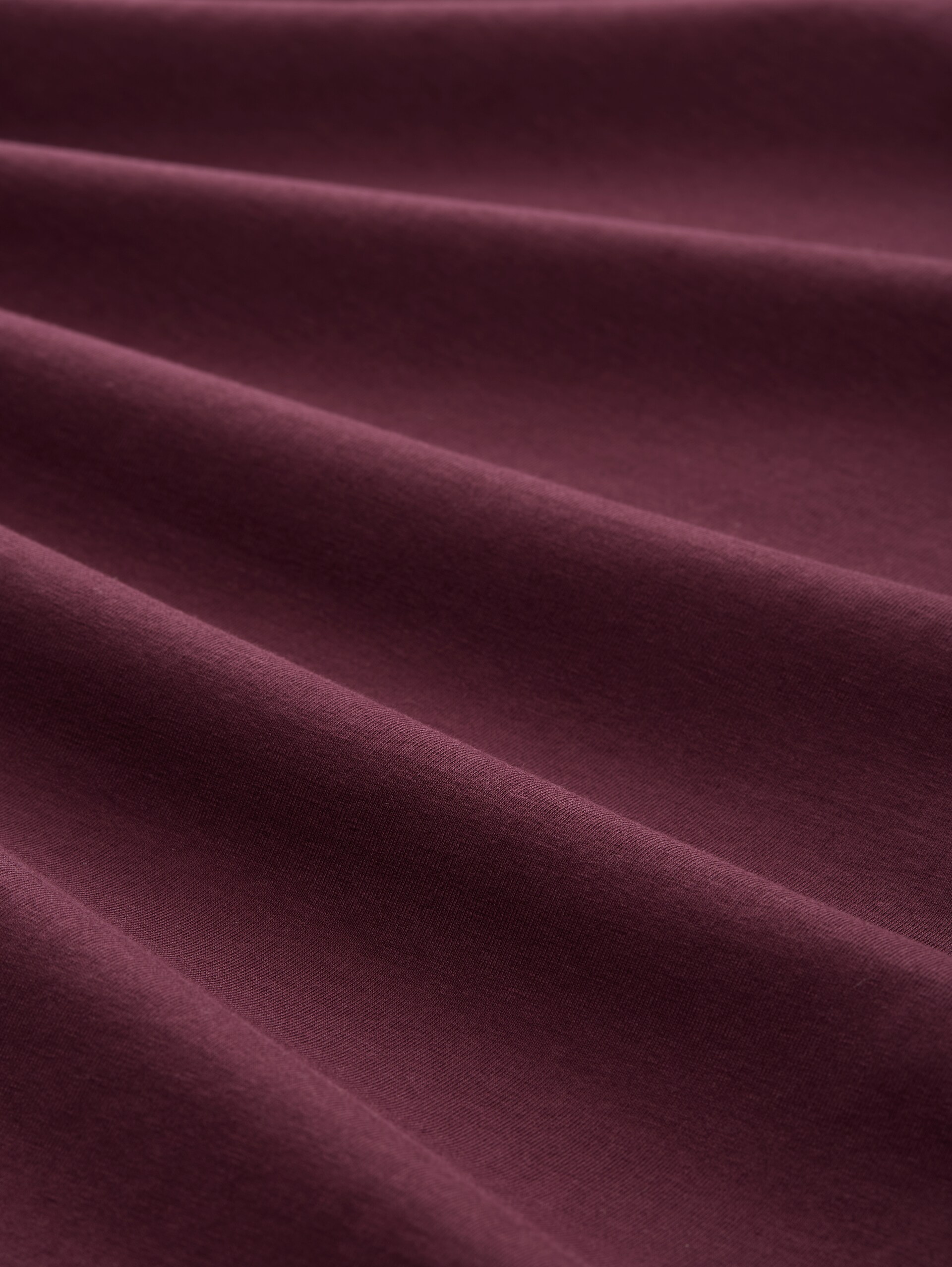 T-Shirt mit Print - bordeaux red - Material-Ansicht