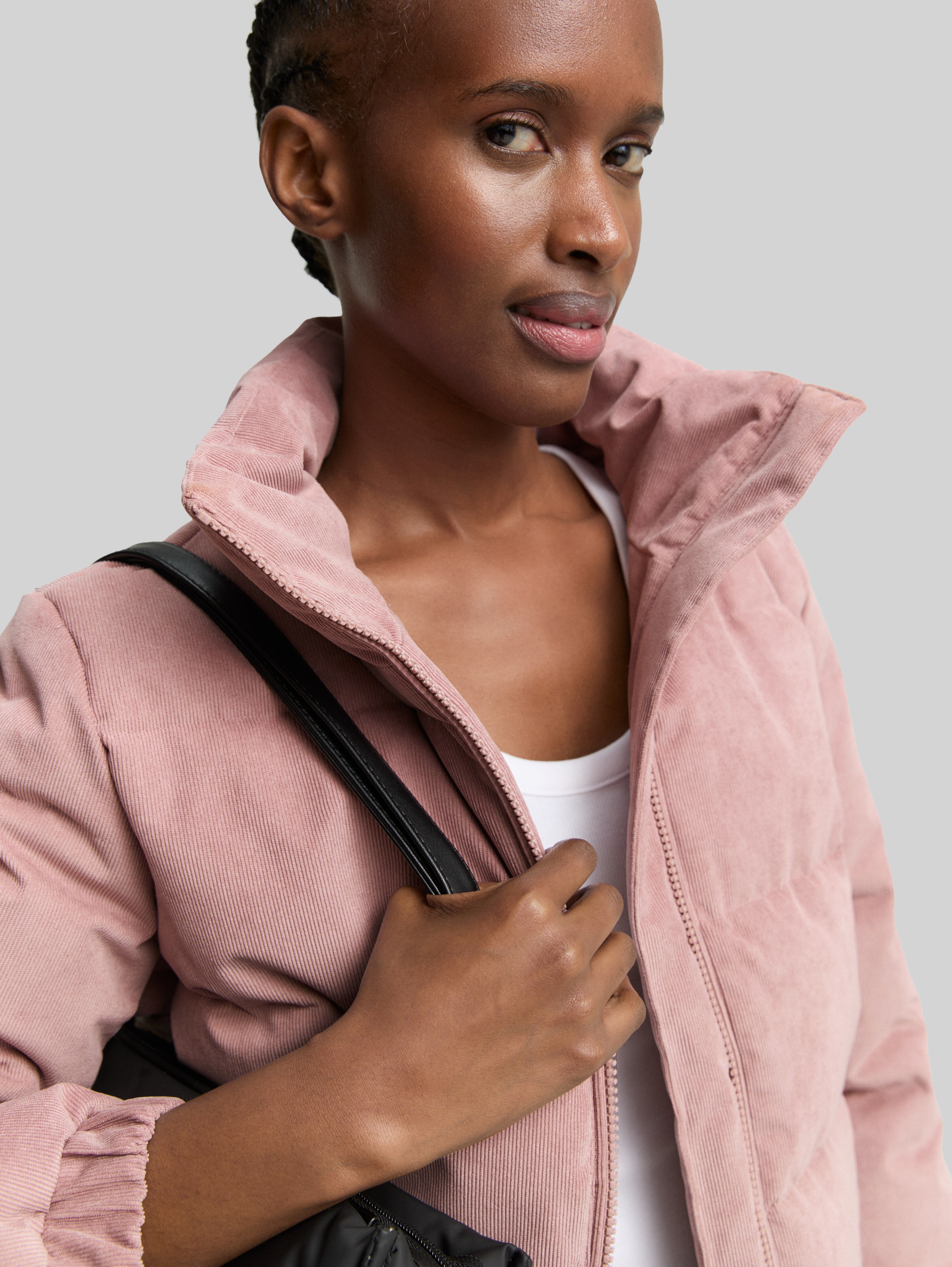 Corduroy puffer jacket with stand-up collar in pink by Tom Tailor