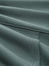 Sweat à capuche Relaxed Fit avec imprimé dans le dos - washed jasper green - Vue de la matière