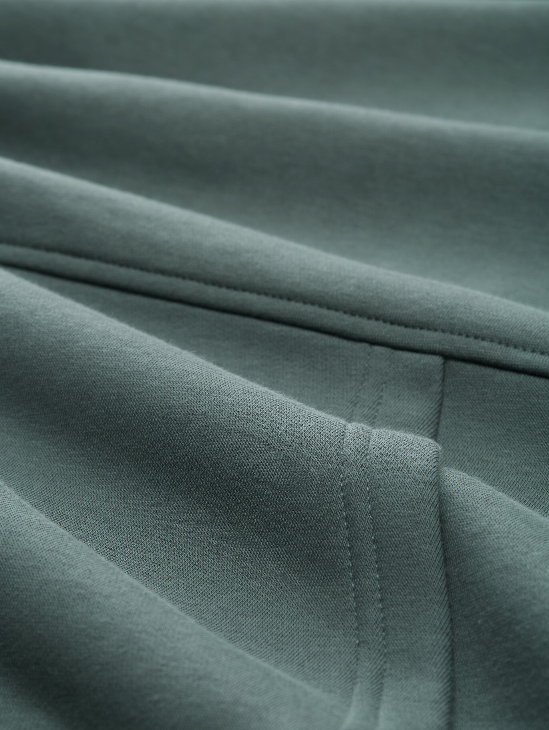 Relaxed Fit Hoodie Sweatshirt mit Rückenprint - washed jasper green - Material-Ansicht
