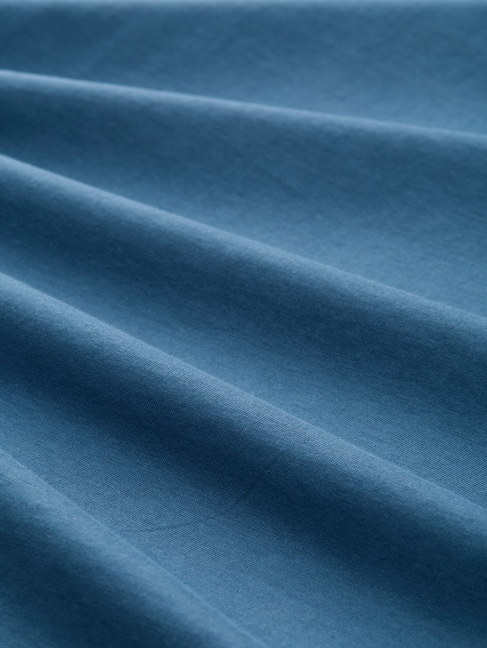 T-Shirt mit Print - real teal blue - Material-Ansicht
