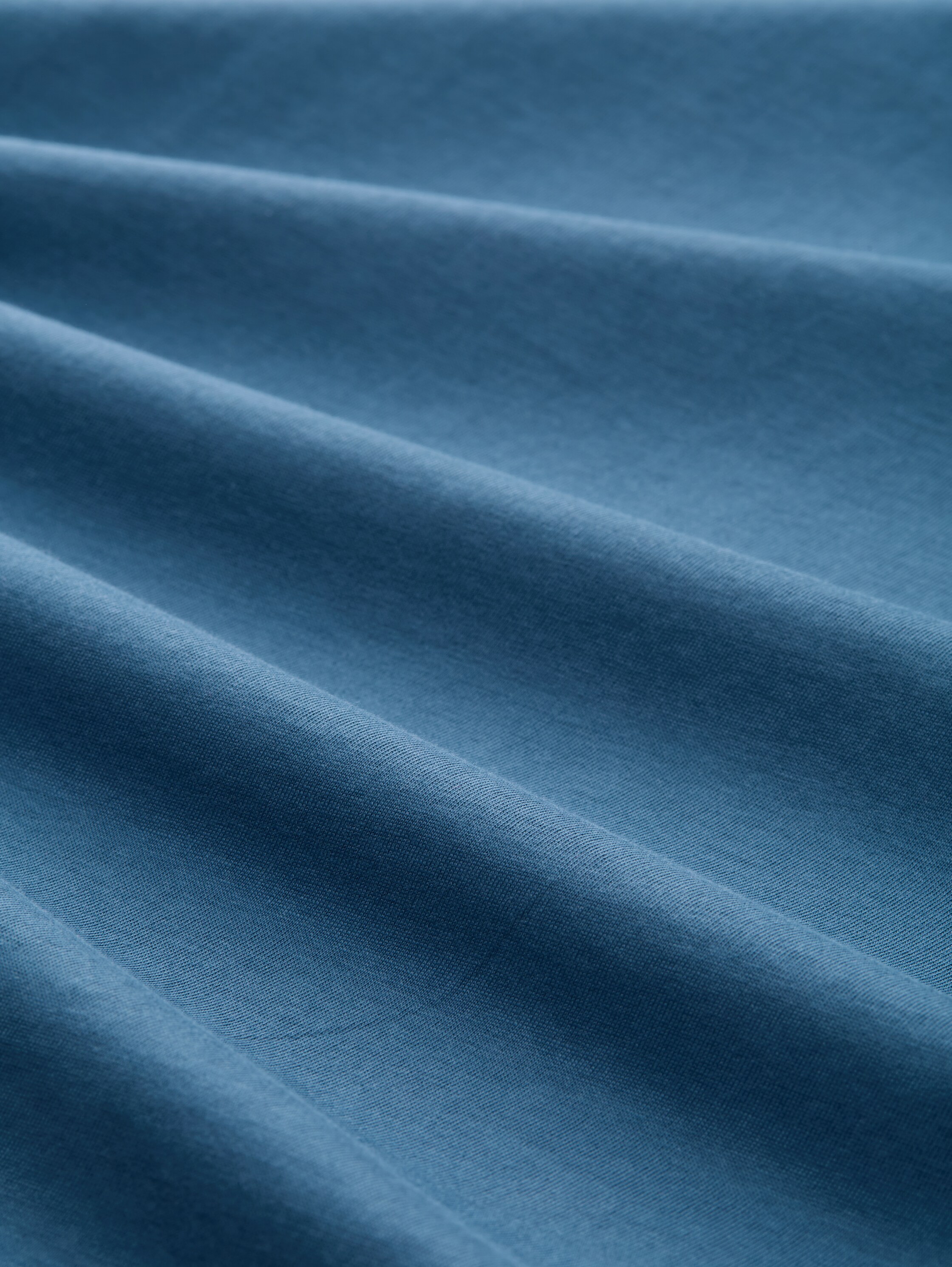 T-Shirt mit Print - real teal blue - Material-Ansicht