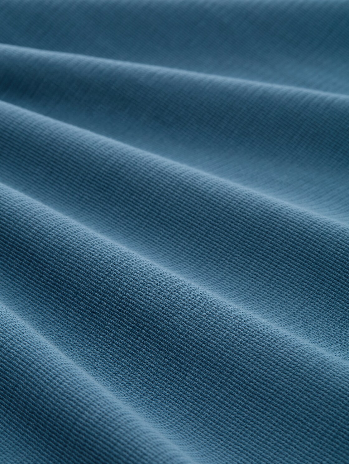 T-Shirt mit Logo-Badge - real teal blue - Material-Ansicht