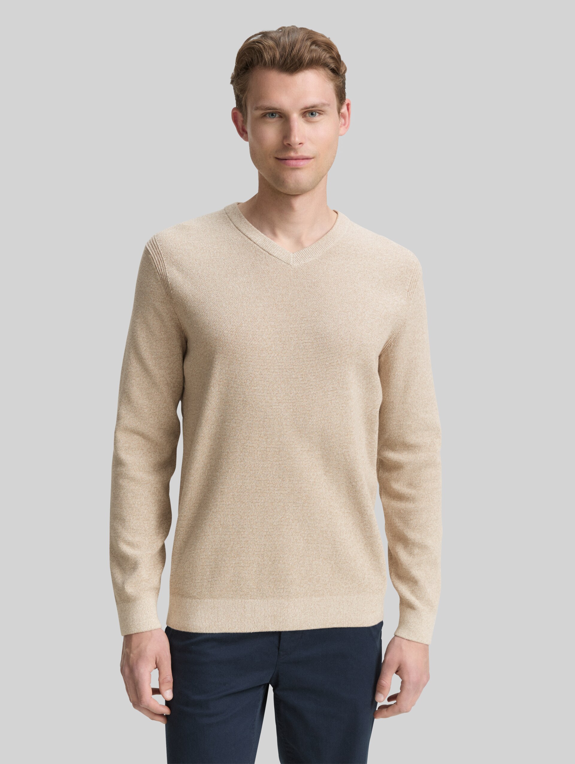 Knitted jumper with V-neck made from organic cotton - beige offwhite twotone - Neckline model front view