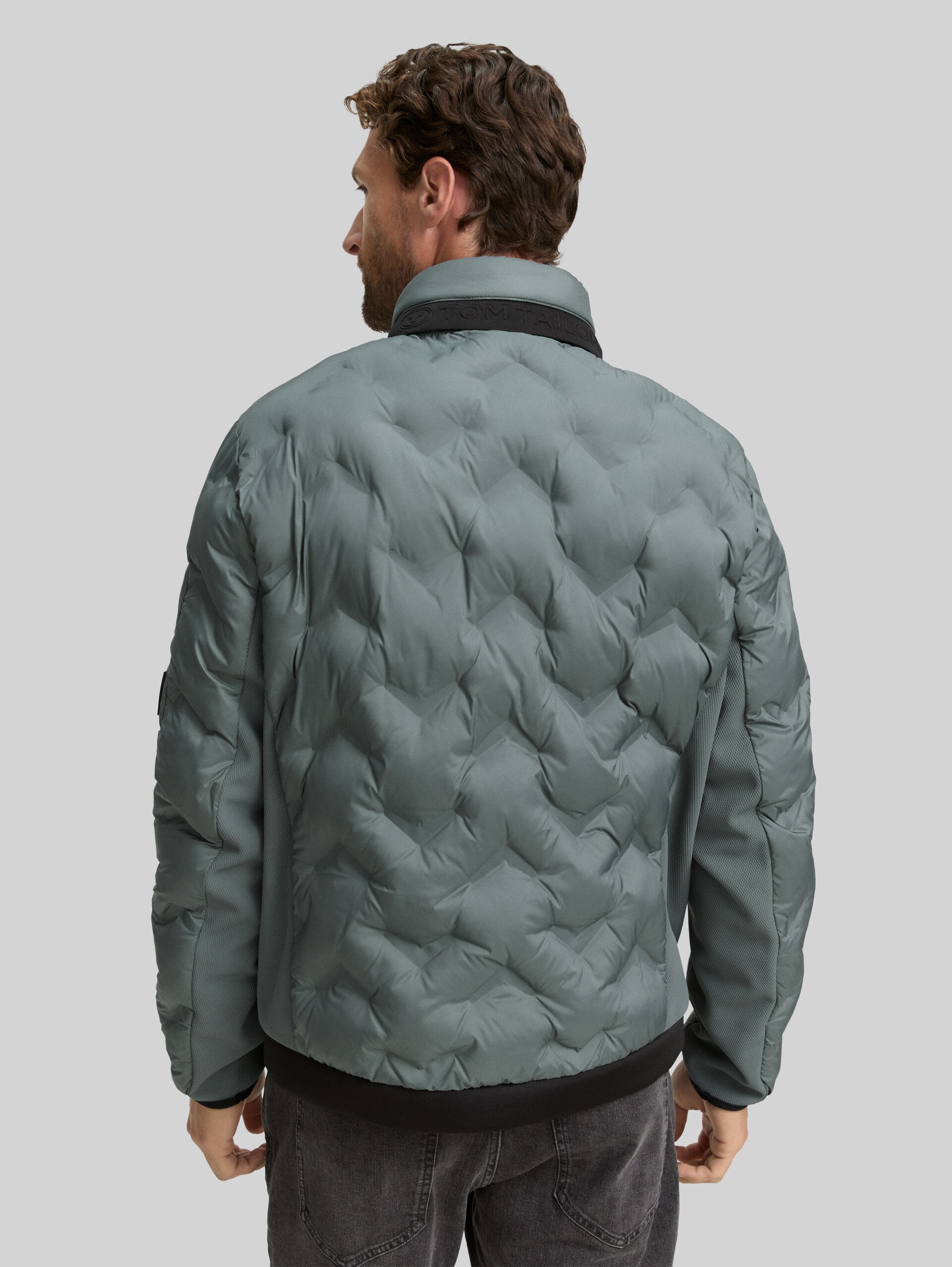 Hybrid quilted jacket with stowable hood - washed jasper green - Model-back view