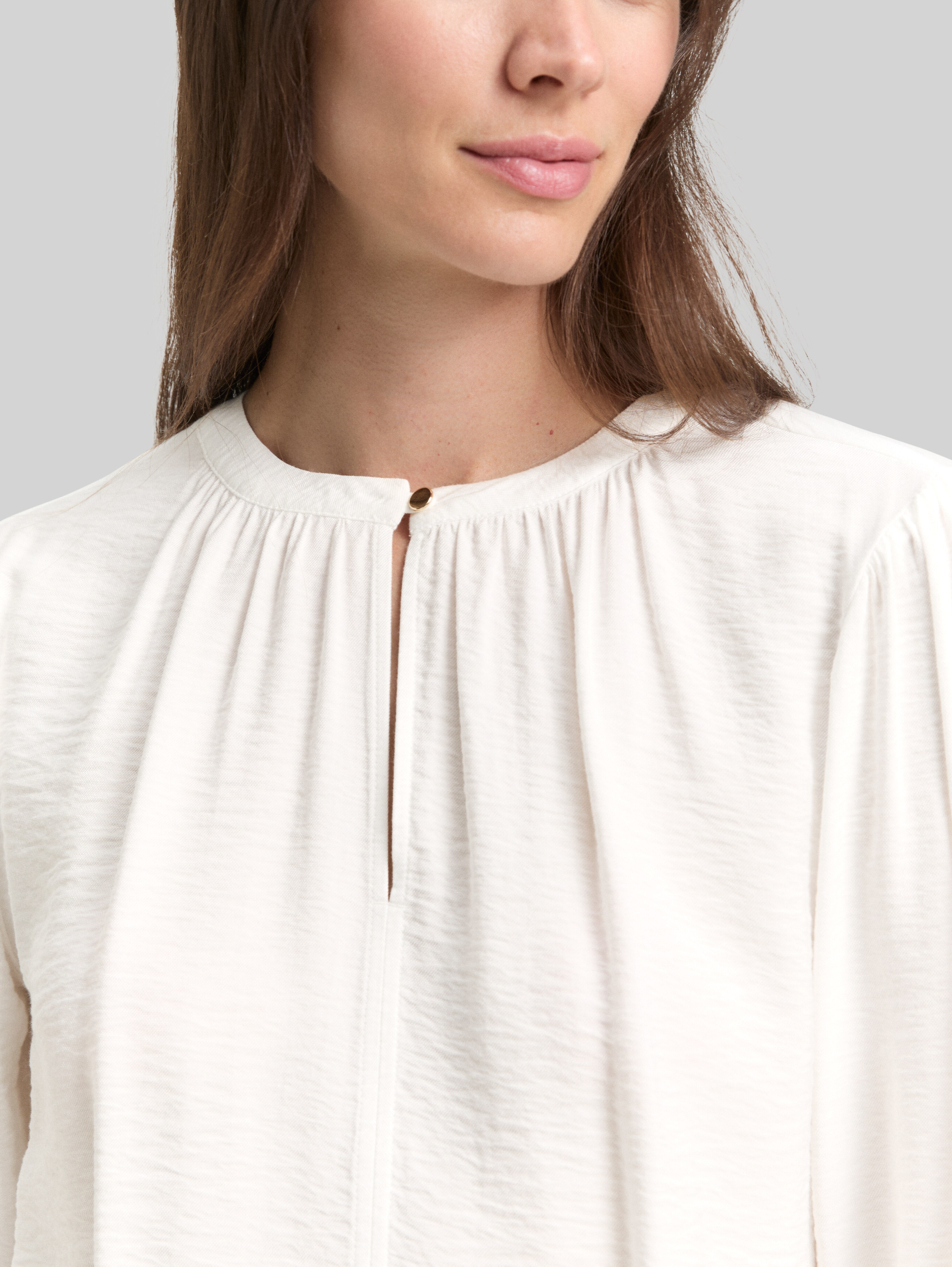 Crinkle blouse with ruffles in white by Tom Tailor