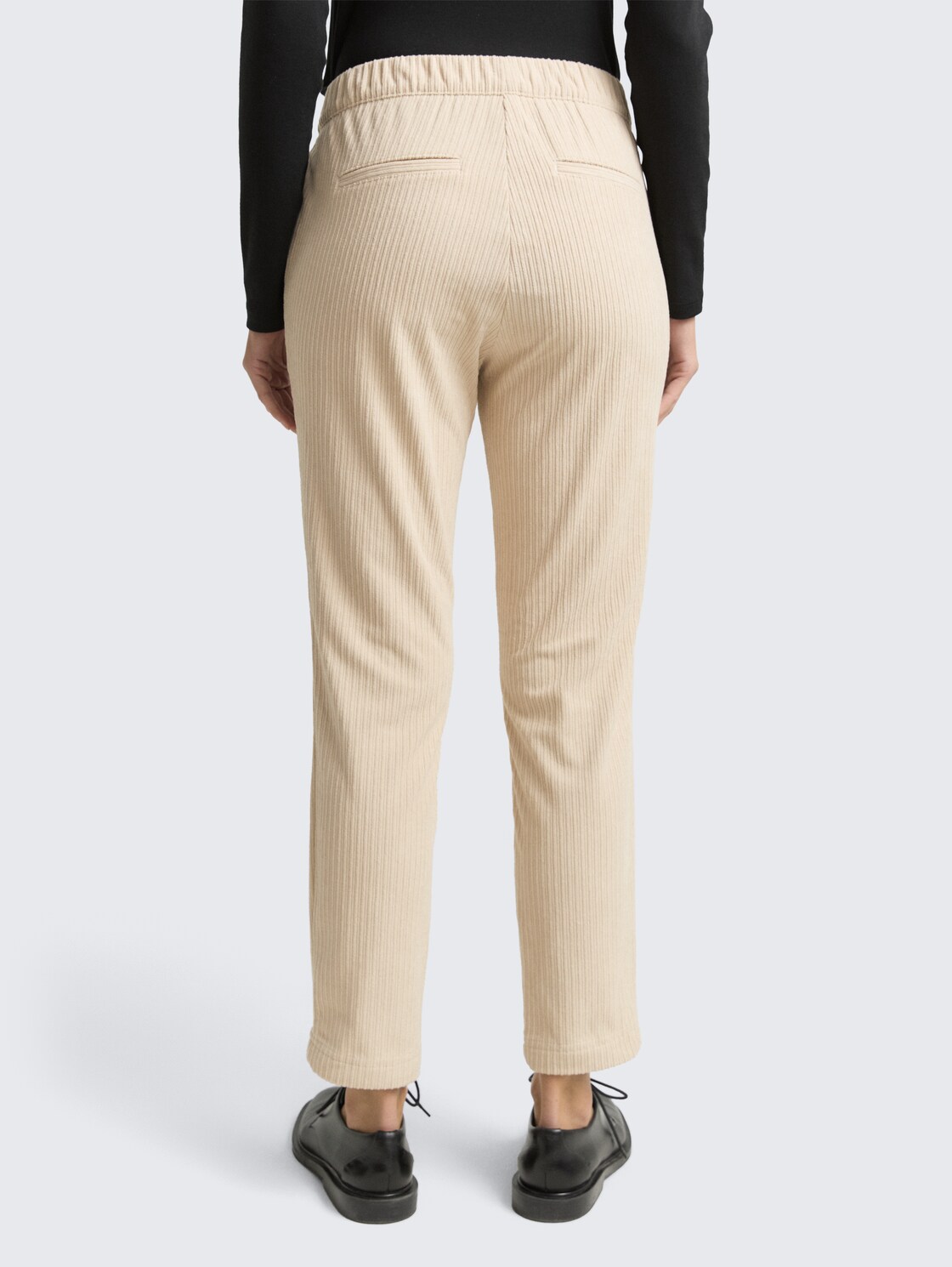 Loose slim corduroy trousers - sand stone beige - Neckline model-back view
