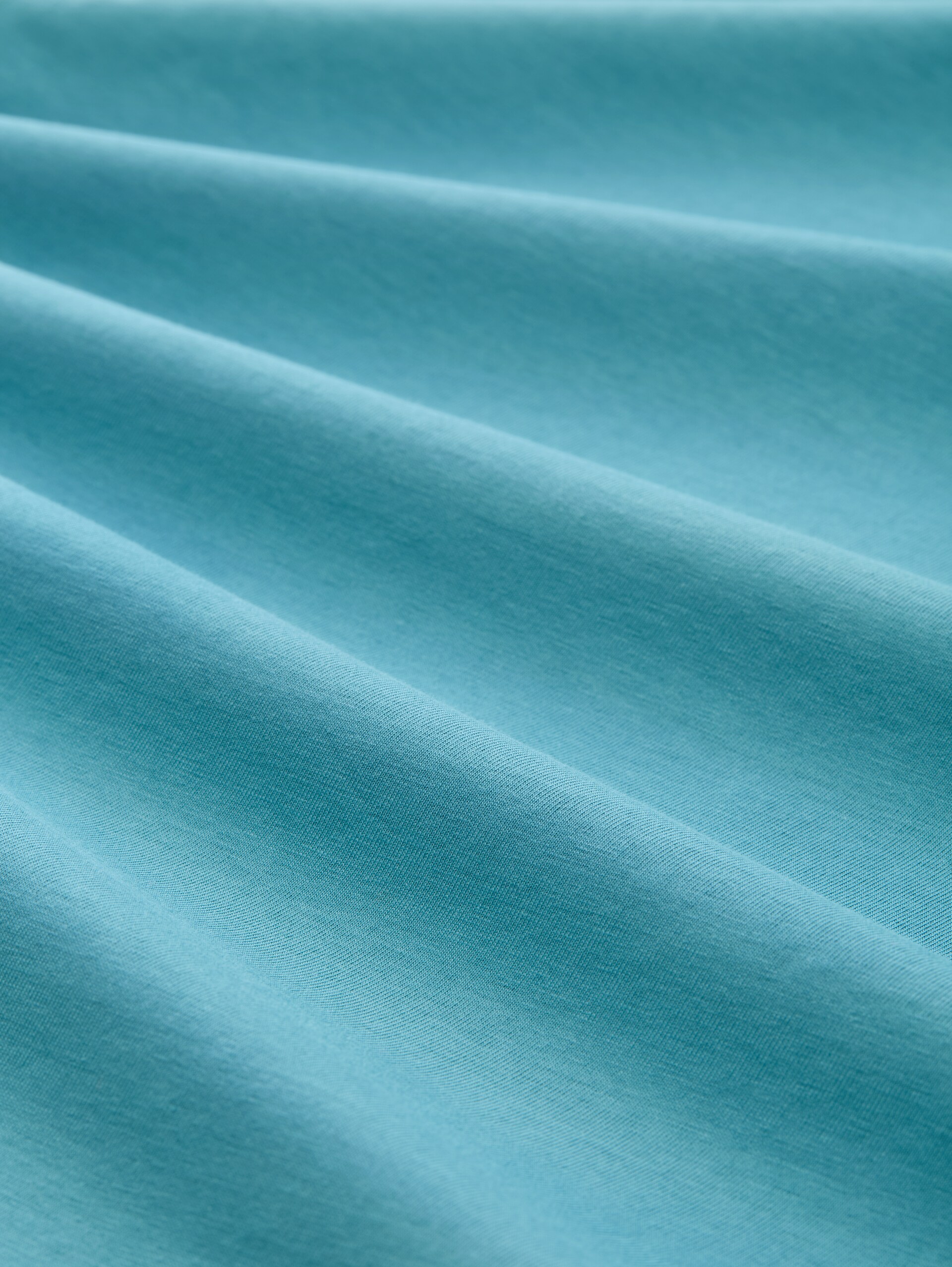 Slim fit long-sleeved shirt with glitter logo - tropical teal - Material view