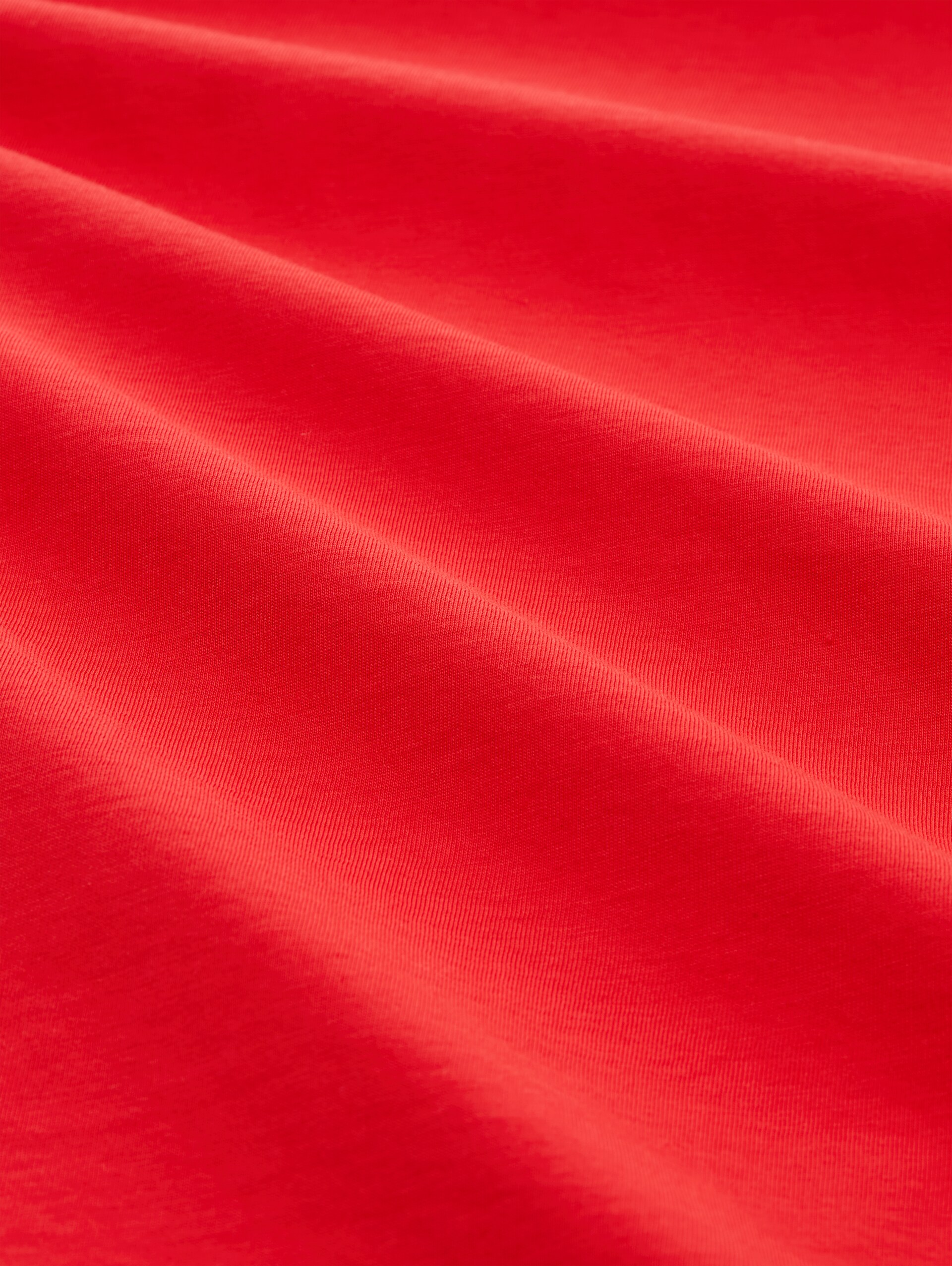 T-Shirt mit Print - brilliant red - Material-Ansicht