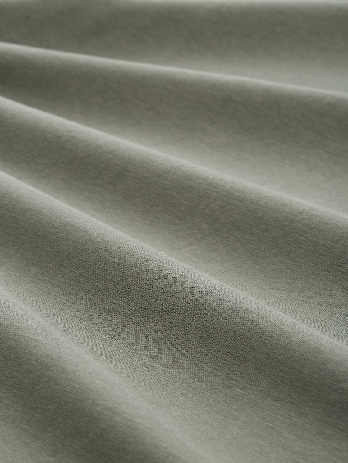 T-Shirt mit Print - cloudy green - Material-Ansicht