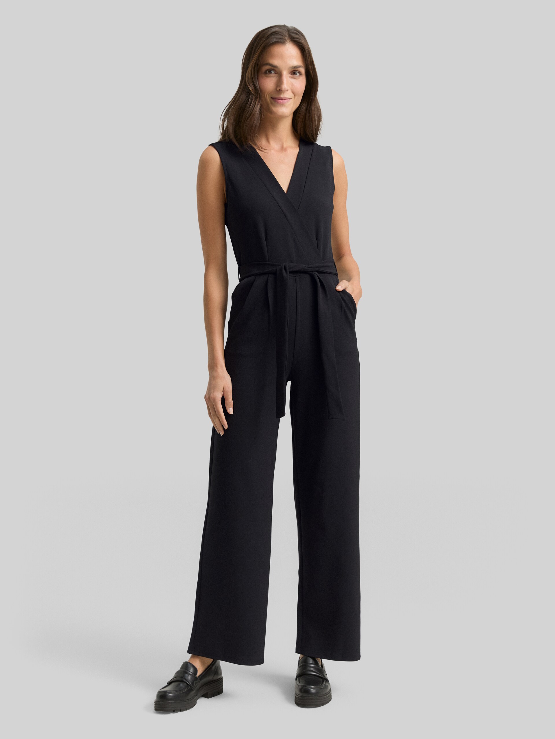 Jumpsuit with a tie belt - deep black - Model front view