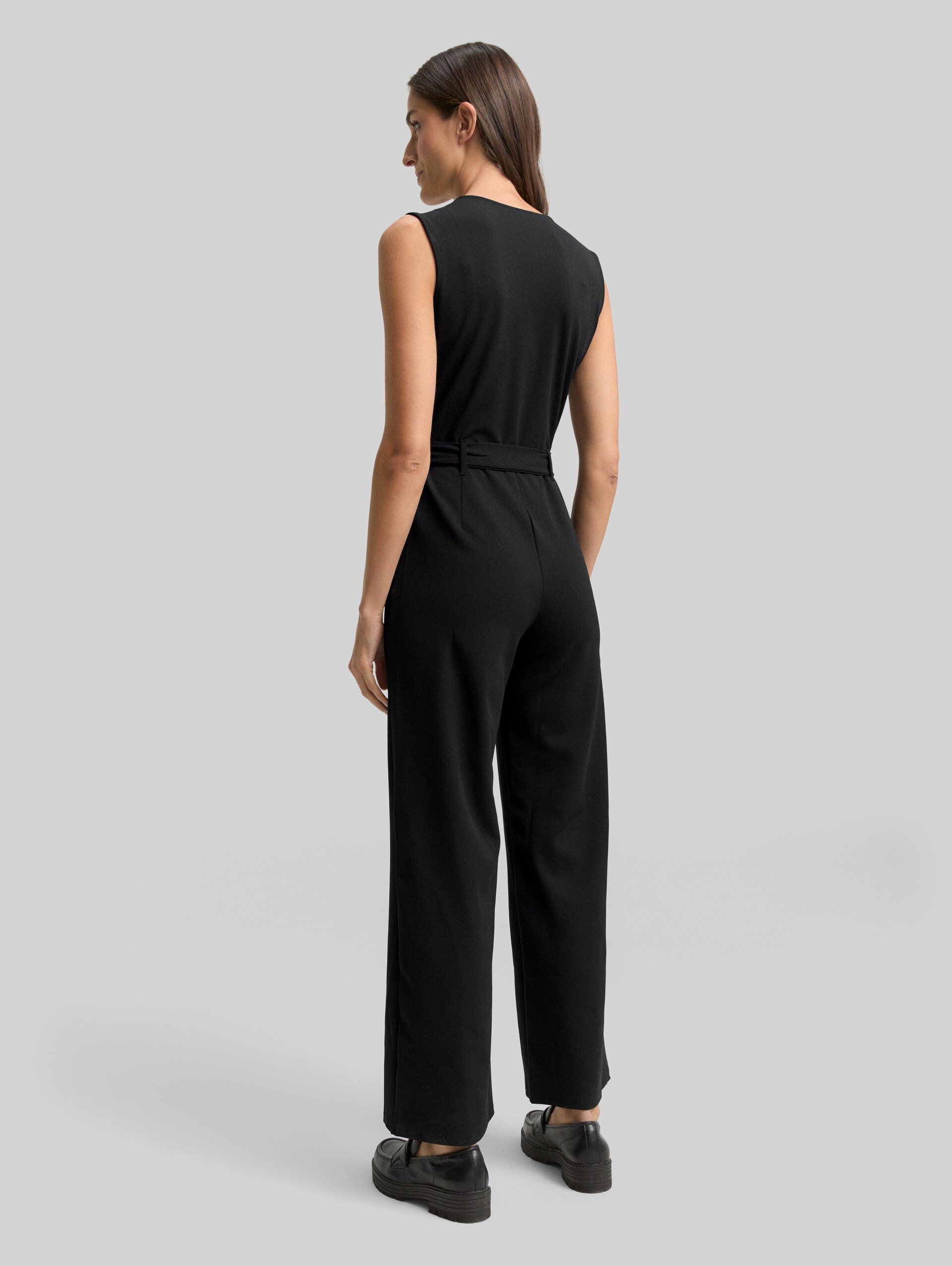 Jumpsuit with a tie belt - deep black - Model-back view