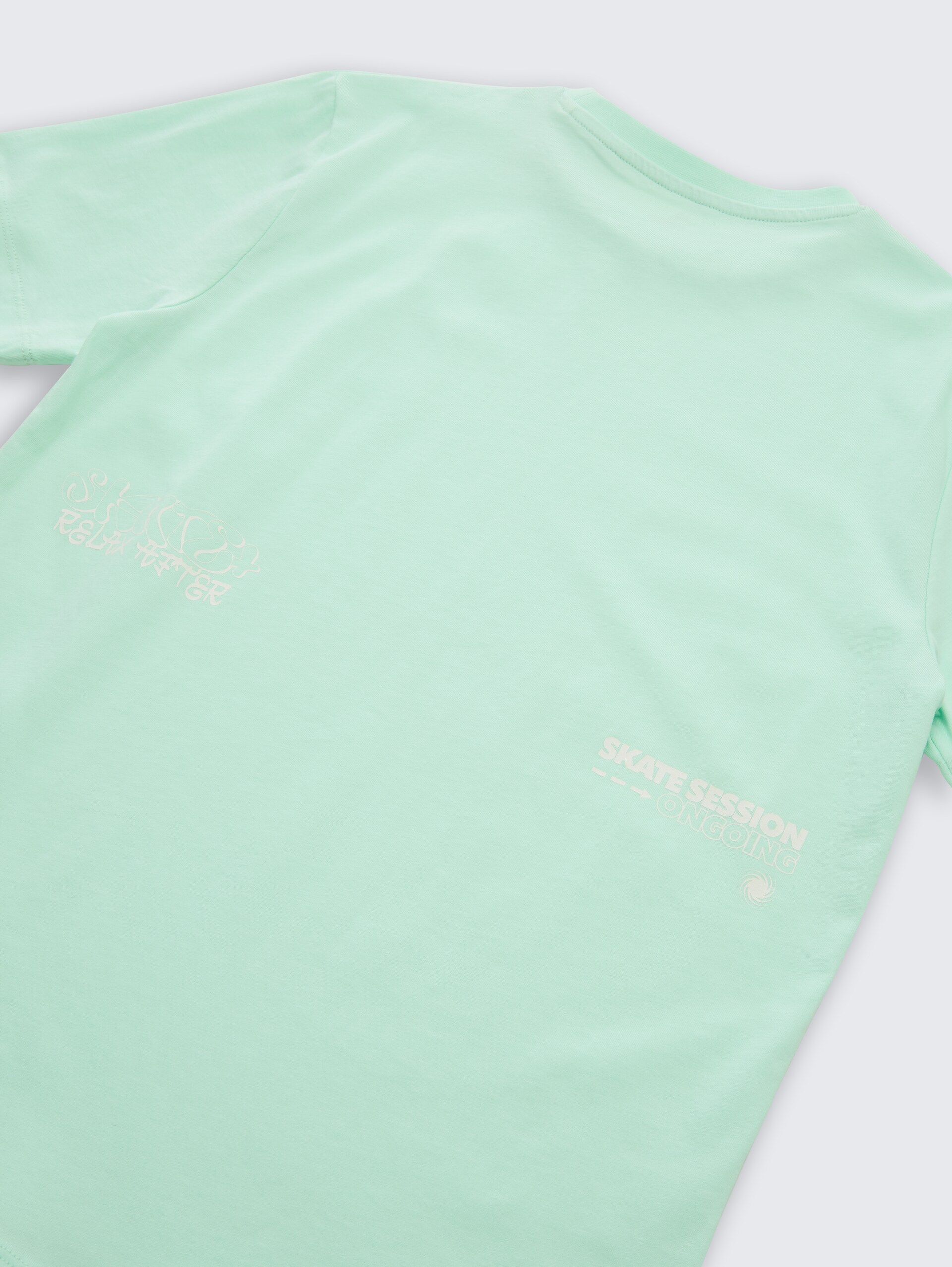 T-Shirt mit Print - soft sugar green - Detail-Model-Ansicht