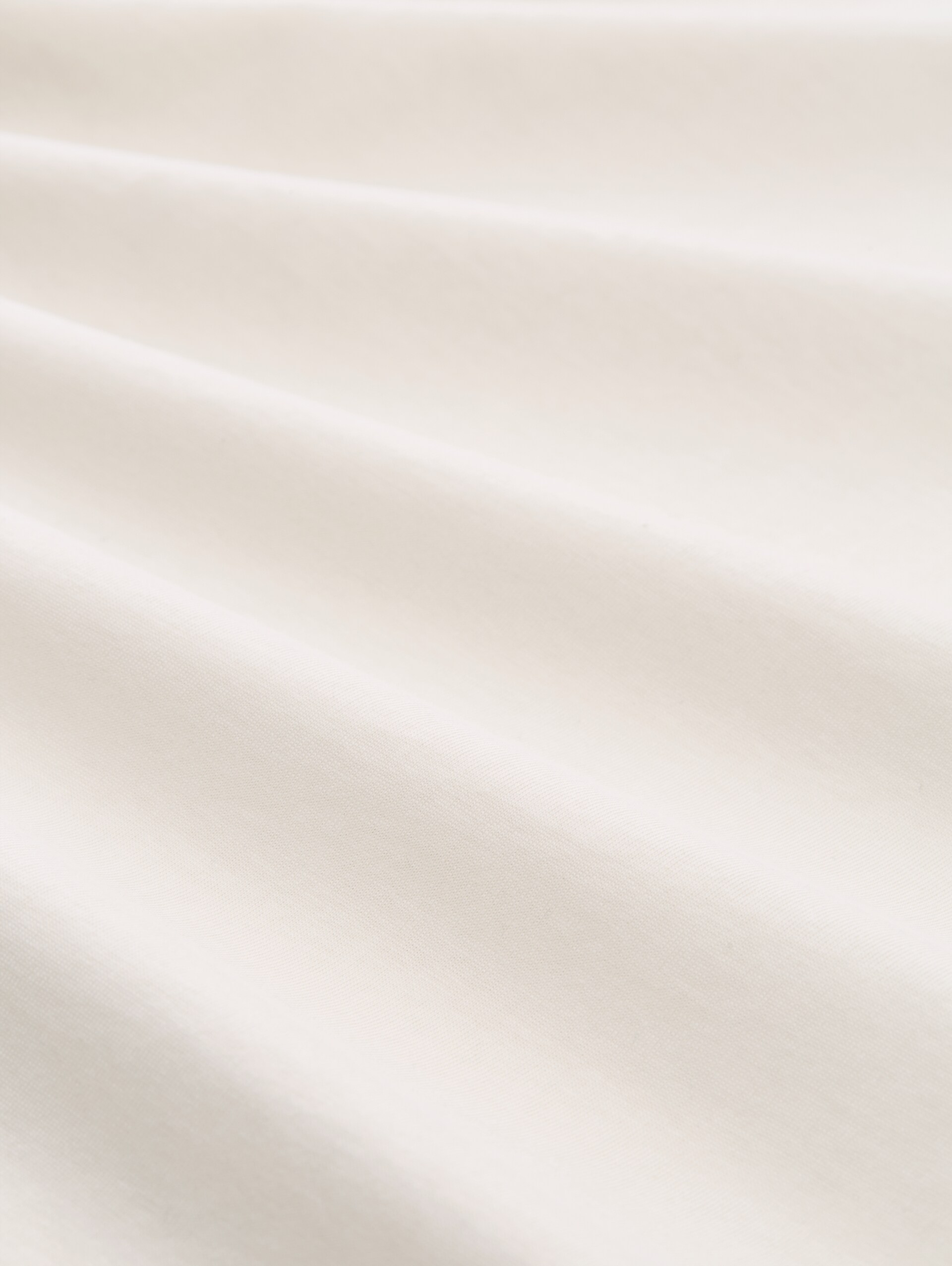 T-Shirt mit Print - Gardenia White - Material-Ansicht