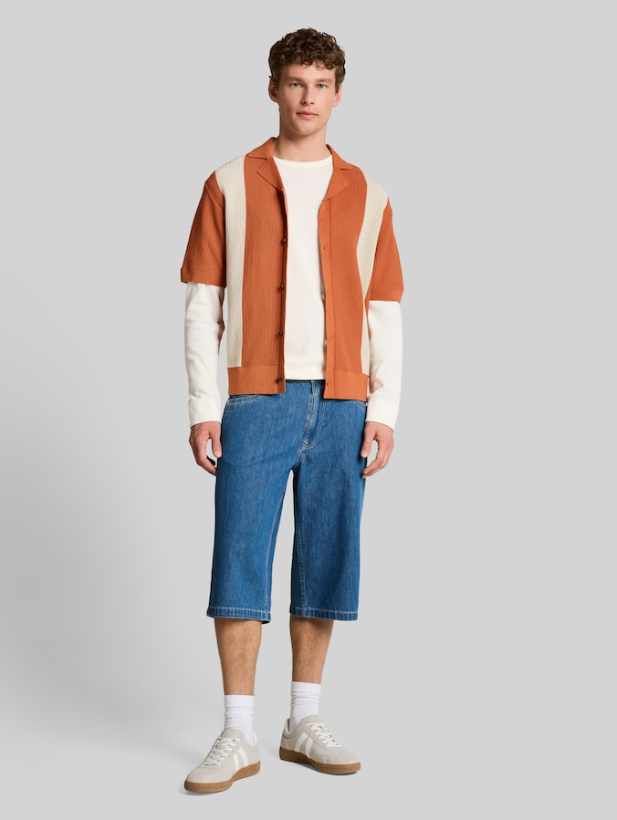 Knitted shirt with a collar by Denim Male, orange white colorblock