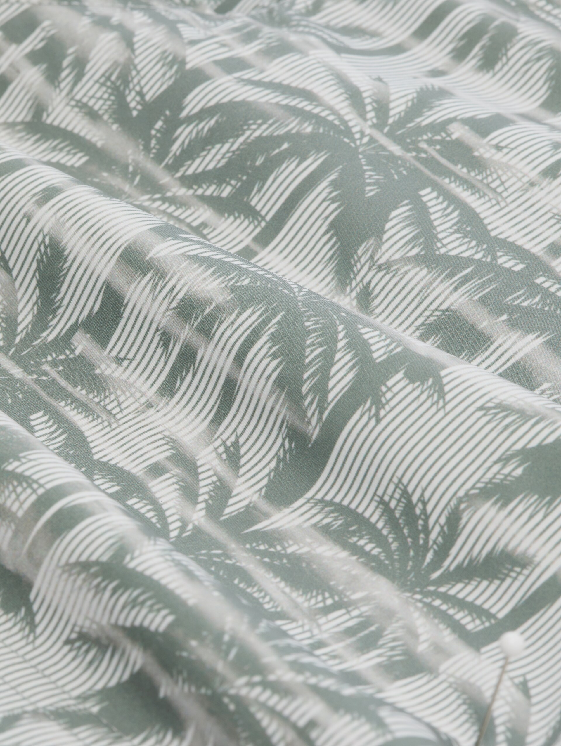 Badeshorts mit Muster - sea spray stripy palm print - Material-Ansicht