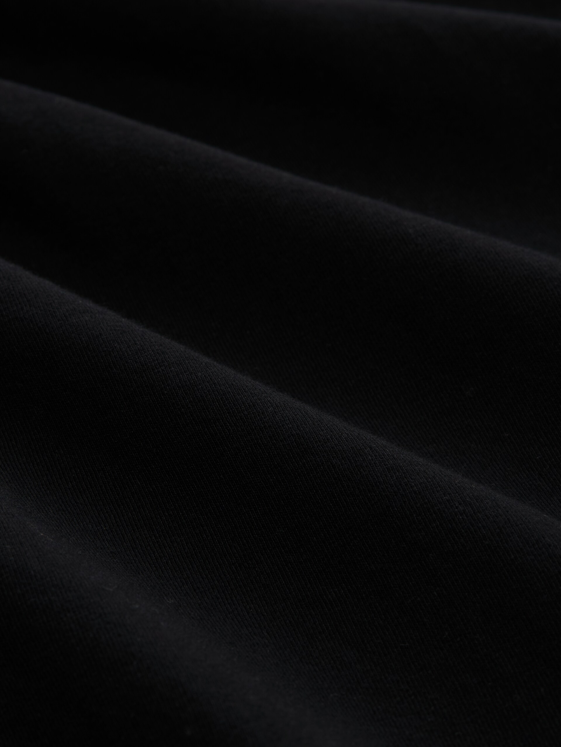 T-Shirt mit Print - Black - Material-Ansicht